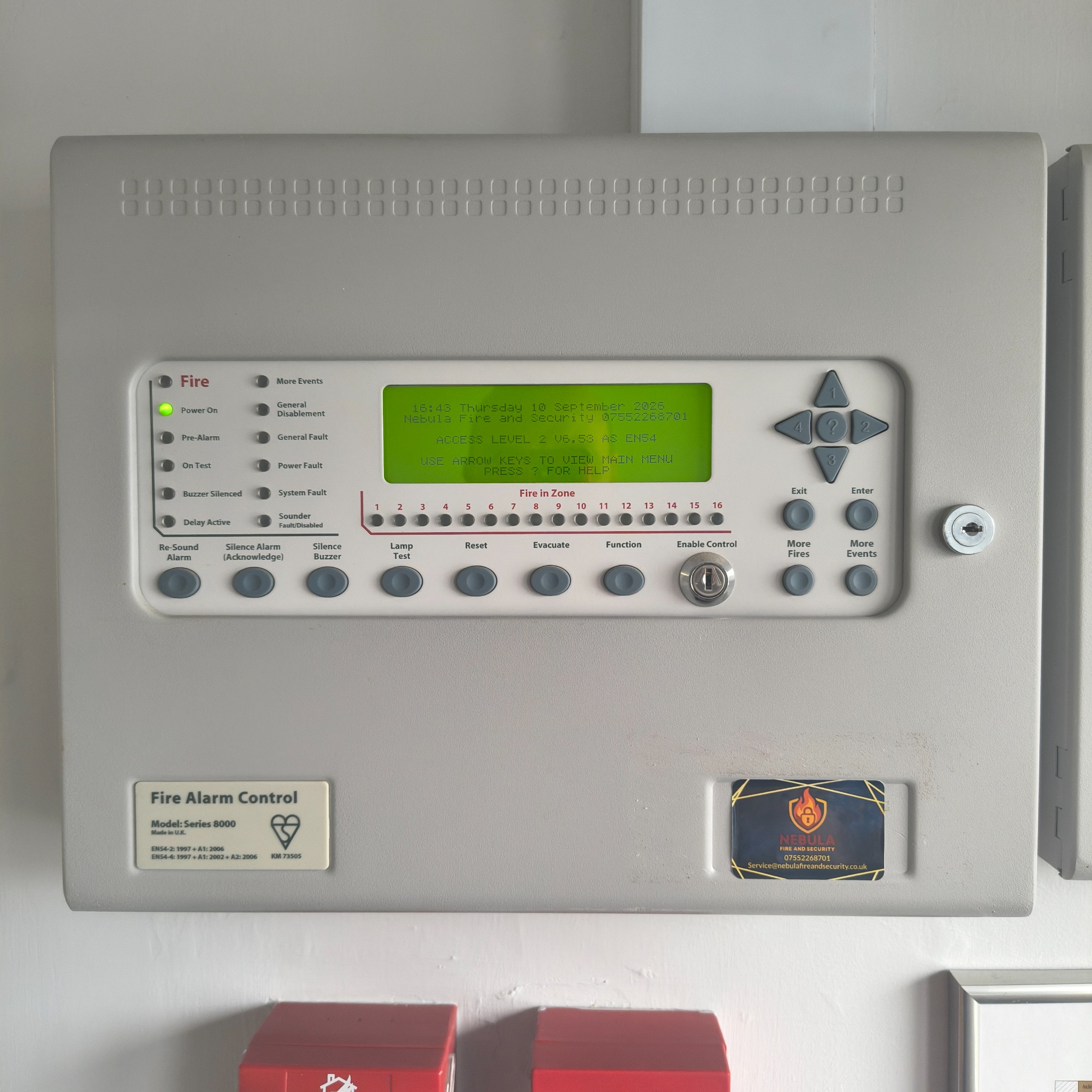 Fire alarm control panel mounted on a wall